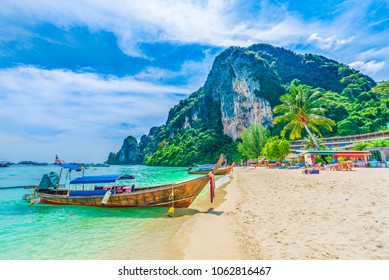 Tonsai Beach bay with traditional longtail boats parking in Phi Phi island, Krabi Province, Andaman Sea,  Thailand - Powered by Shutterstock