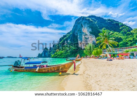 Tonsai Beach bay with traditional longtail boats parking in Phi Phi island, Krabi Province, Andaman Sea,  Thailand