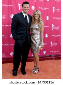 Tony Romo & Carrie Underwood At The Academy  Of Country Music Awards MGM Grand Garden Arena Las Vegas, NV May 15, 2007