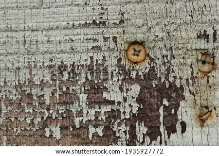 I took a shot of this decaying wall of a dilapidated store down the street. Unkempt and exposed to the elements, the paint wears off. And the screws rusts and bleeds into the wood.