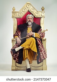 I took the throne peacefully. Studio shot of a richly garbed king sitting on a throne. - Shutterstock ID 2147373347