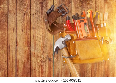 Tool Belt Close Up On Wooden Table In Sunlight