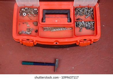 
Tool Box With Different Types Of Screws And Nails, Seen From Above.