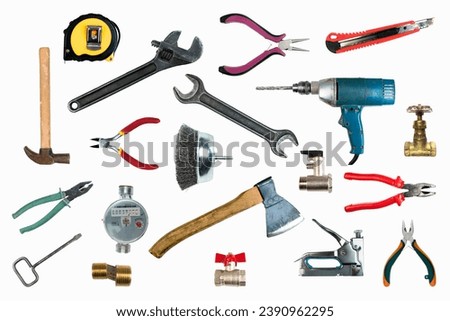 Tool collage isolated on a white background depicting carpentry and construction tools. Top view