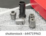 The tool collets set on the bubble absorb with red container box.The CNC machine component