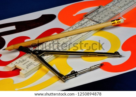 A tool for drawing lesson and creativity.  Drawing-a graphic image made in scale, a pattern for drawing curves, a compass for drawing circles, a Logarithmic ruler allows you to perform mathematical ca