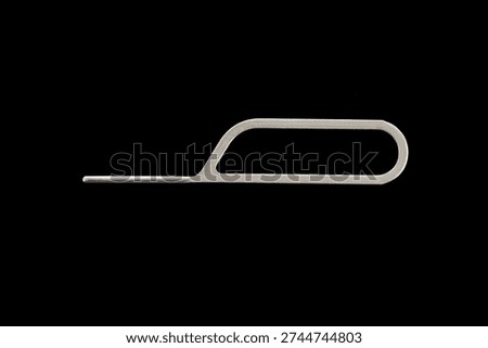 Tool for eject SIM card phone isolated on white background