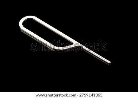 Tool for eject SIM card phone isolated on white background