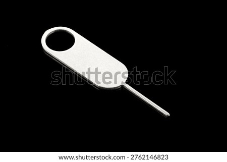 Tool for eject SIM card phone isolated on white background