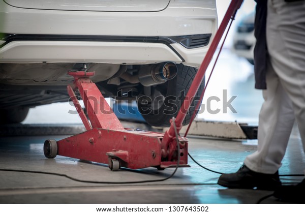 tool jack lift car for Maintenance and Check of\
cars at service car center\
