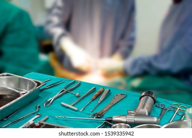 Tool, For Orthopedic Surgery, On A Blurred Background Of Surgeon Team.