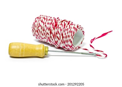 Tool with red and white thread for drill and bind the paper on a white background