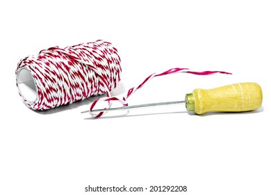 Tool with red and white thread for drill and bind the paper on a white background