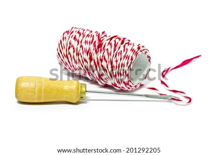 Tool with red and white thread for drill and bind the paper on a white background