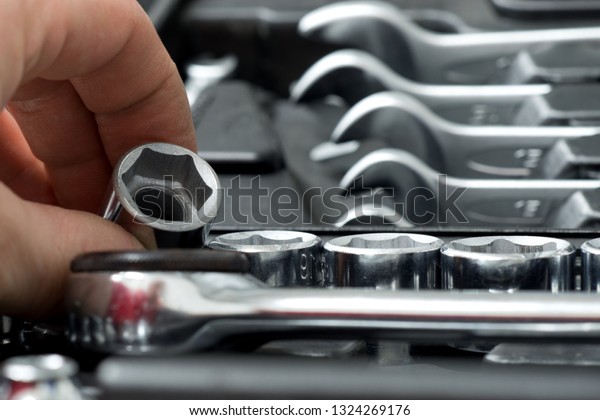 Tool\
repairman, mechanic tool set in the\
background.