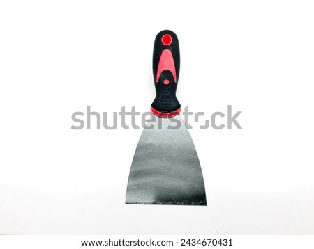 A tool for scraping wall paint with a rubber handle made from thin plate iron with a white background