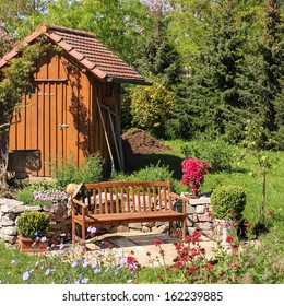 Tool Shed And Seat In The Garden