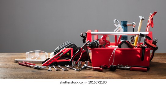 Toolbox With Different Worktools Against Grey Background