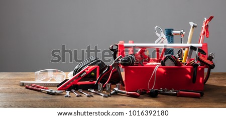Toolbox With Different Worktools Against Grey Background