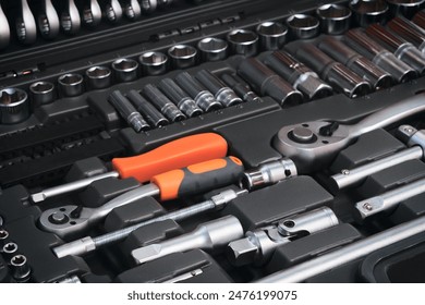 A toolbox with many different tools including pliers, wrenches, and screwdrivers. The tools are organized in a way that makes it easy to find what you need