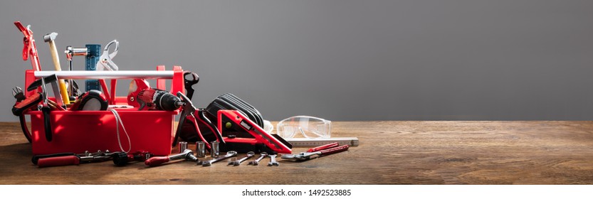 Toolbox With Various Work Tools On Wooden Desk - Powered by Shutterstock