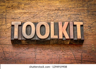 toolkit - word abstract in vintage letterpress wood type against grained wooden background