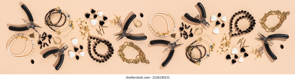Tools and accessories for DIY jewelry in the workplace. Flat lay on beige background. Creative flat lay, panoramic composition, extra wide banner, top view. DIY craft hobby, homemade business.