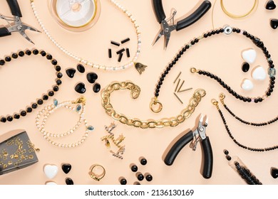 Tools and accessories for DIY jewelry in the workplace. Flat lay on beige background. Creative flat lay composition, top view. DIY craft workshop, homemade business. Making handmade for friends gifts - Powered by Shutterstock