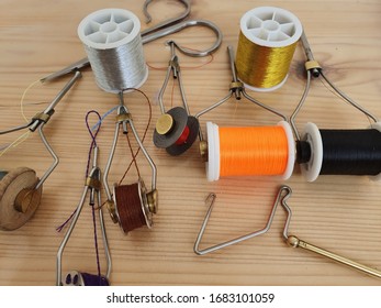 Tools And Accessories For Making Fishing Lures. Multicolored Threads On Reels.