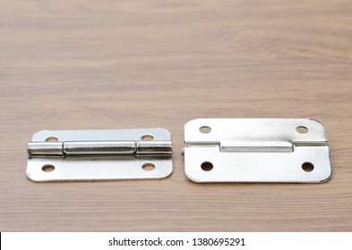 Tools And Auto Spare Parts As Well As Door Hinge On A Wooden Work  Bench Surface.