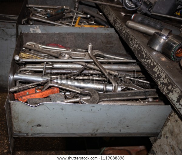 tools for car repair\
lie in an iron box
