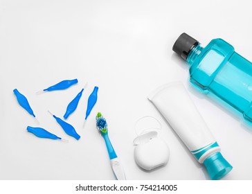 Tools For Dental Care: Orthodontic Brush, Floss, Toothpaste. Invisible Dental Aligners Modern Tooth Brackets Transparent Braces To Straighten Teeth In Cosmetic Dentistry And Orthodontics