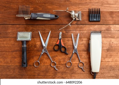 tools for dog grooming on the wooden surface of the table

