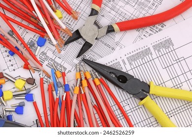 Tools for electrical work during the assembly of equipment. Close-up. Soft focus.