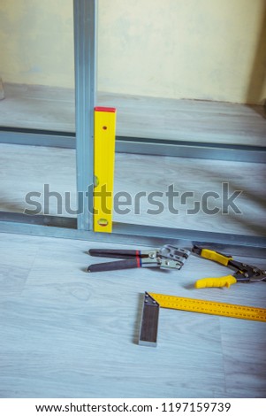 tools and equipment for plasterboard mounting
Stack of drywall metal profiles. 