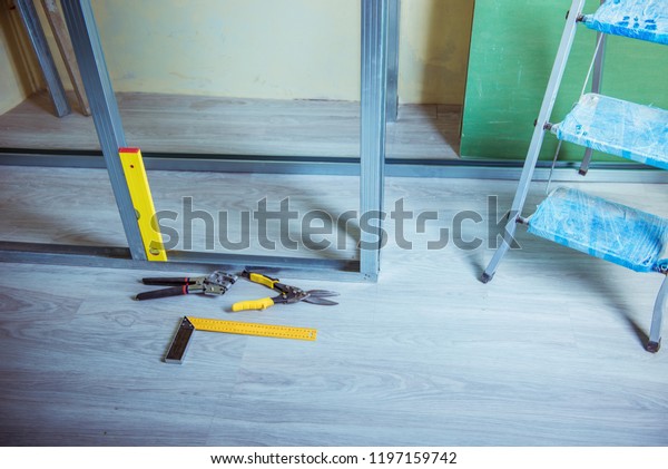 tools and equipment for plasterboard
mounting
Stack of drywall metal profiles.
