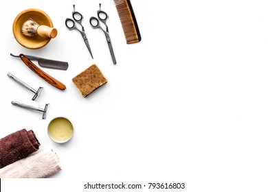 Tools for haircut and shave. Razor, sciccors, brush on white background top view copy space