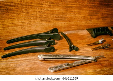 Tools hairdressers. Barber Tools on a wooden background