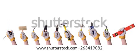 Tools in hand . Isolated on white background .