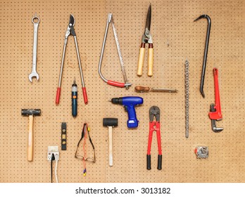 Tools Hanging On A Pegboard Wall