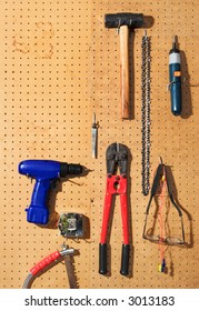 Tools Hanging On A Pegboard Wall