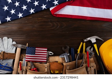 Tools hardhat toolbelt and us flag on wooden background labor day banner mockup - Shutterstock ID 2317298441