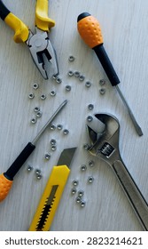 Tools and Hardware Scattered on Work Table Flat Lay Image
