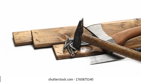 Tools For Manual Labor, Ax, Hammer And Nails With Wooden Planks Isolated On White Background