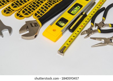 Tools for master builder on gray background stacked after work