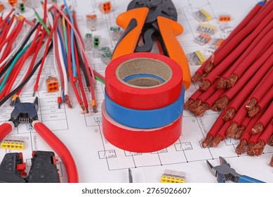 Tools and materials for assembling an electrical switchboard in the workplace.