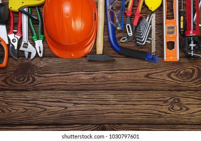 Tools on wood  background . Top view. - Shutterstock ID 1030797601