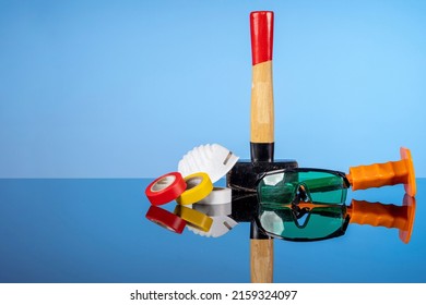 Tools For Repair And Construction, A Sledgehammer, A Chisel, Goggles, A Mask And Electrical Tape. Do It Yourself Concept, Sale Of Goods For Renovation And Construction, Home Renovation Services.