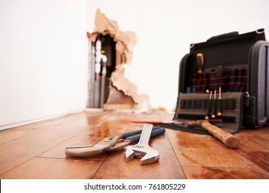 Tools and toolbox lying on flood damaged floor