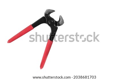 Tools - Top view open carpenter's pincers with red handles isolated on a white background.